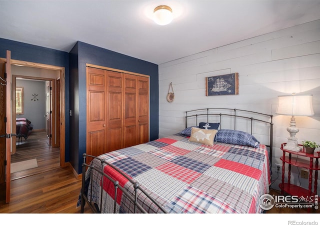 bedroom featuring a closet and wood finished floors