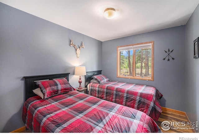 bedroom with wood finished floors