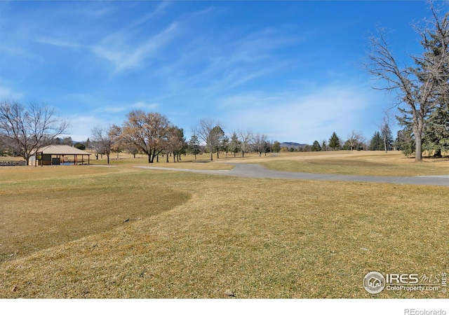 surrounding community with a lawn and a gazebo