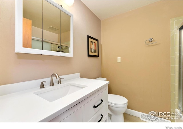 full bathroom featuring walk in shower, vanity, and toilet