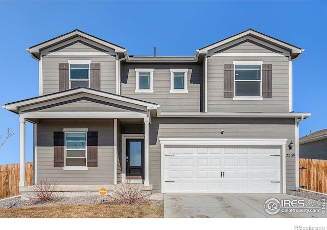 2539 Alto St, Fort Lupton, CO 80621 - traditional-style house featuring a garage, driveway, and fence