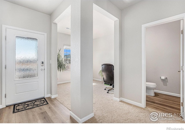 2539 Alto St, Fort Lupton, CO 80621 - entrance foyer with visible vents, baseboards, and wood finished floors