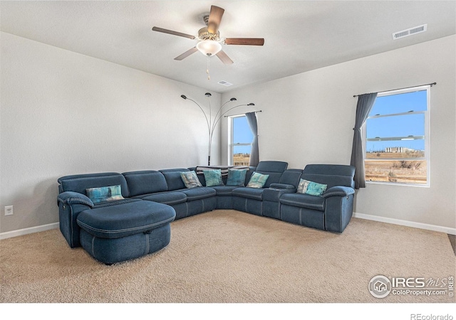 2539 Alto St, Fort Lupton, CO 80621 - carpeted living room with a ceiling fan, visible vents, and baseboards