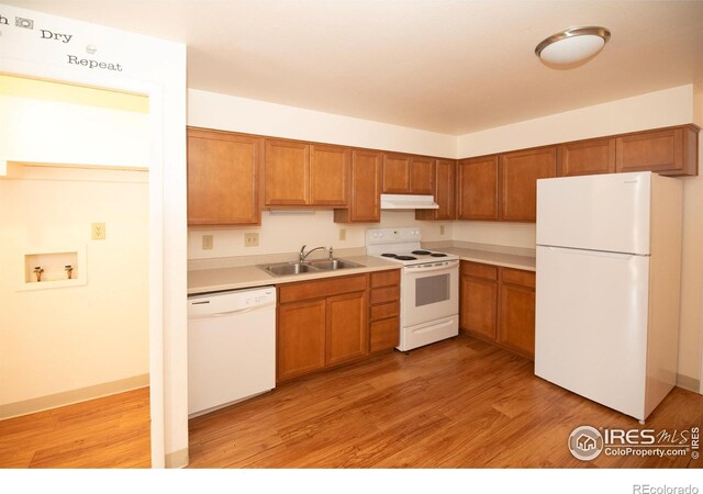 216-218 E Saint Clair Ave, Longmont, CO 80504 - kitchen featuring white appliances, a sink, under cabinet range hood, and light wood finished floors