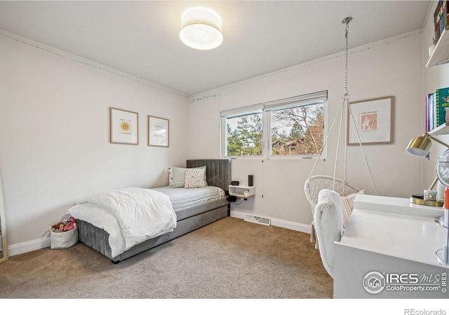 bedroom featuring carpet flooring, visible vents, and baseboards