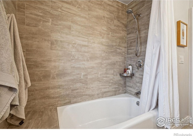 bathroom featuring shower / tub combo with curtain