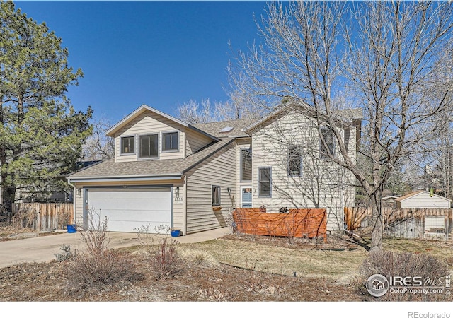 view of front of property featuring roof with shingles, fence, driveway, and an attached garage