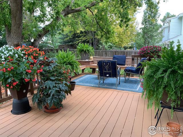 wooden deck featuring outdoor dining space and fence