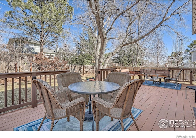 deck with fence and outdoor dining space