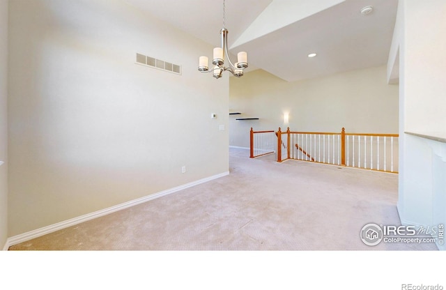 carpeted spare room featuring lofted ceiling, a chandelier, recessed lighting, visible vents, and baseboards