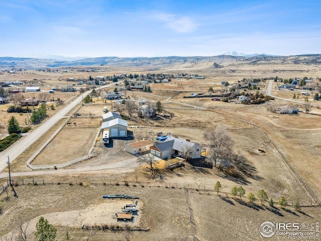 bird's eye view featuring a rural view and a mountain view