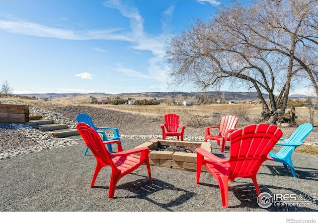 view of patio / terrace featuring an outdoor fire pit