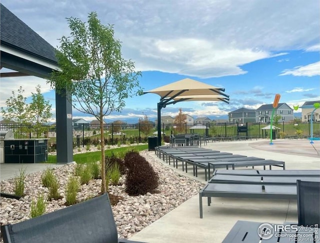 view of community featuring a patio area and fence