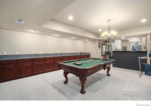 recreation room with light carpet, visible vents, indoor wet bar, and recessed lighting