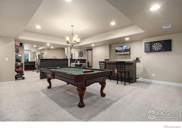 playroom with recessed lighting, a raised ceiling, light colored carpet, and a dry bar