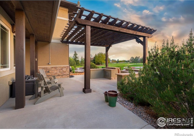 patio terrace at dusk with a pergola