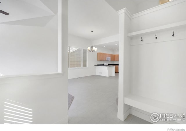 mudroom featuring recessed lighting and ceiling fan with notable chandelier