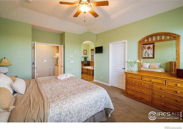 bedroom with arched walkways, carpet, lofted ceiling, and ceiling fan