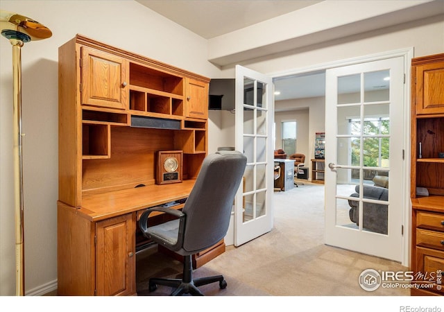 office space with light carpet and french doors