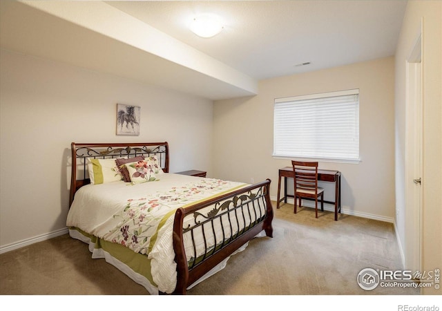 bedroom with visible vents, carpet, and baseboards