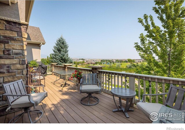 wooden deck featuring outdoor dining space