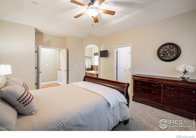 13943 W 87th Ln, Arvada, CO 80005 - bedroom featuring arched walkways, carpet flooring, and ceiling fan