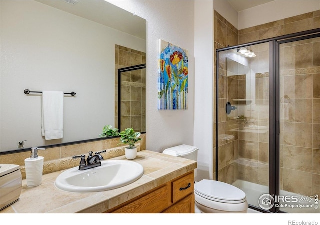 13943 W 87th Ln, Arvada, CO 80005 - full bathroom featuring toilet, vanity, and a shower stall