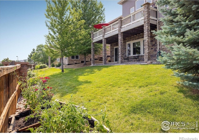 13943 W 87th Ln, Arvada, CO 80005 - back of property with stone siding, a lawn, and a deck