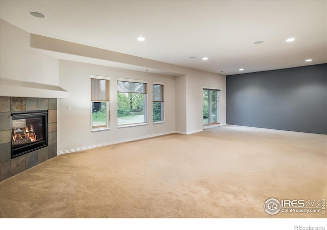 13943 W 87th Ln, Arvada, CO 80005 - unfurnished living room with carpet, recessed lighting, a fireplace, and baseboards