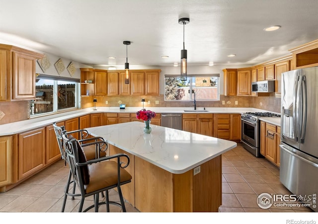 kitchen featuring open shelves, decorative backsplash, appliances with stainless steel finishes, a sink, and a kitchen island