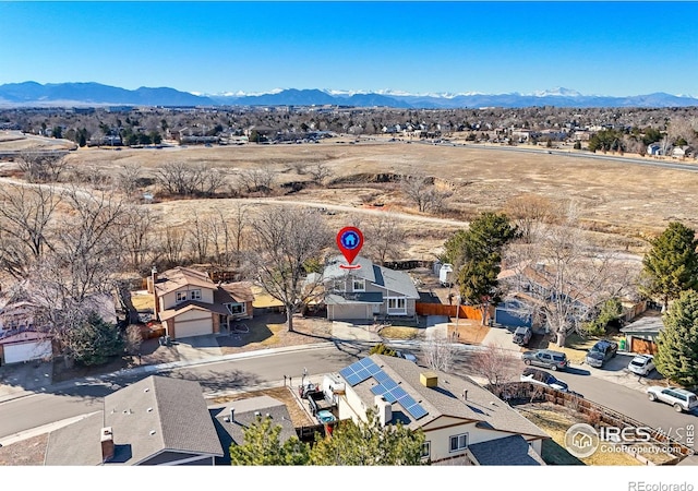 birds eye view of property with a residential view and a mountain view