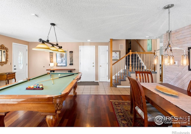 rec room featuring a textured ceiling, wood finished floors, and pool table