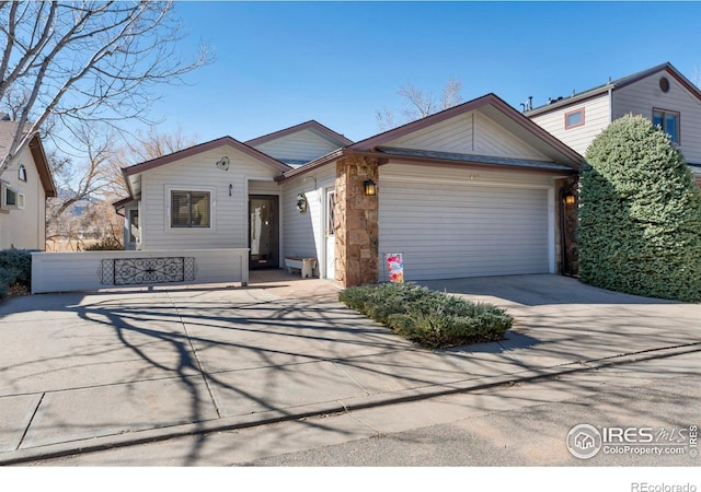 view of front of home featuring concrete driveway and a garage