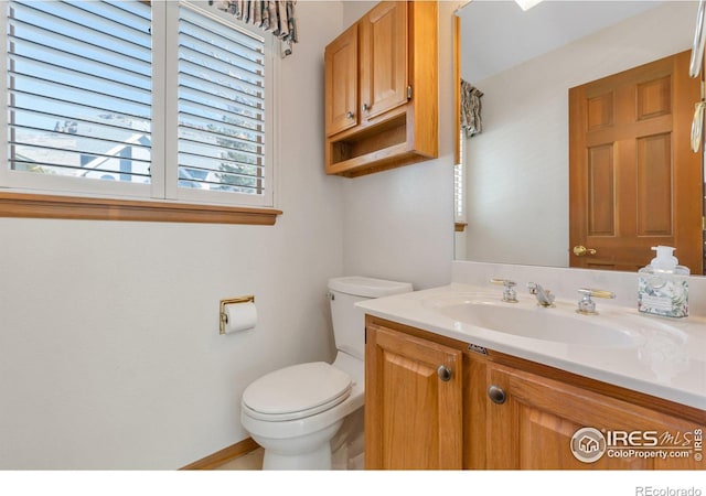 bathroom featuring vanity and toilet