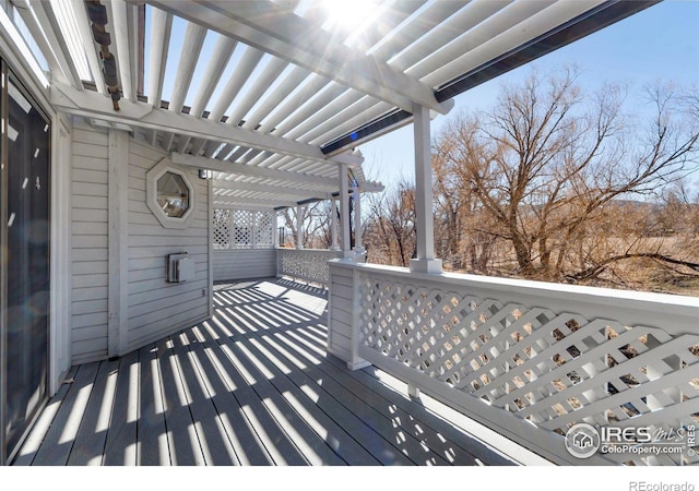 wooden terrace with a pergola