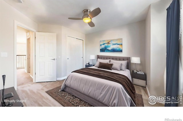 carpeted bedroom featuring baseboards, a ceiling fan, and a closet