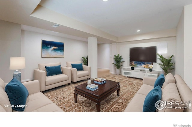 living room featuring visible vents and recessed lighting