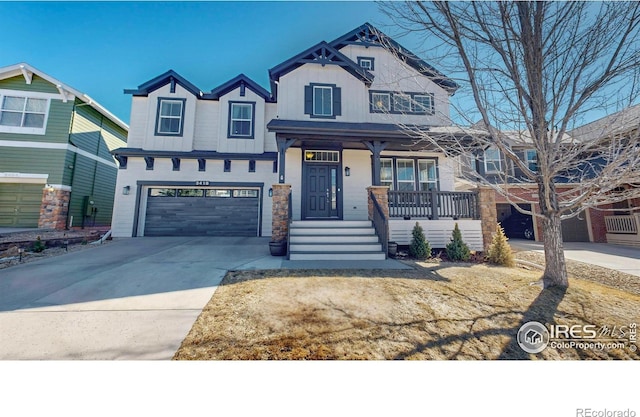 view of front of house featuring a garage, driveway, a porch, and board and batten siding