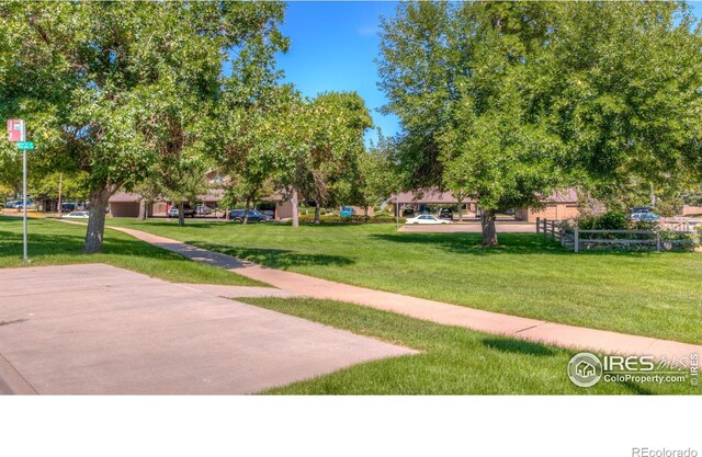 view of home's community featuring a yard