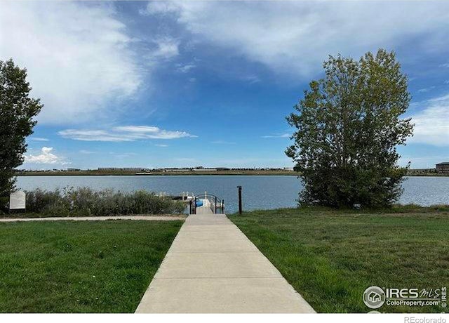 4110 S Park Dr, Loveland, CO 80538 - view of dock featuring a water view and a lawn
