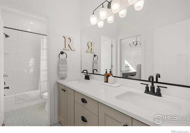 bathroom with a sink, shower / bathtub combination with curtain, toilet, and double vanity