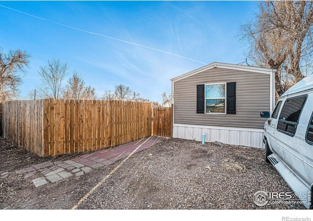 view of home's exterior with fence