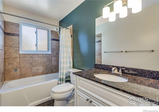 bathroom featuring shower / bath combination with curtain, vanity, and toilet