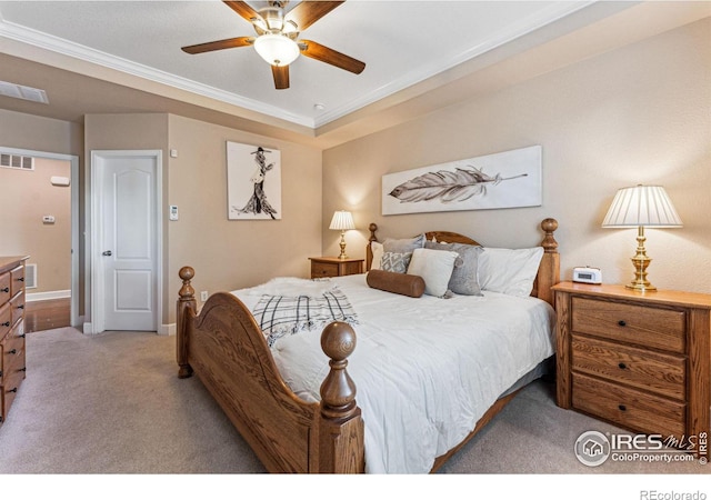 bedroom featuring baseboards, visible vents, carpet flooring, and ornamental molding