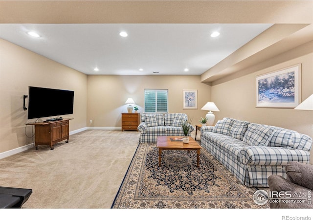 living area featuring recessed lighting, light colored carpet, and baseboards