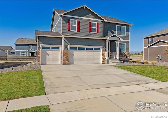 view of front of home featuring a front yard and concrete driveway