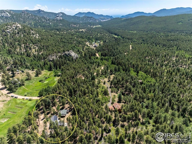 aerial view featuring a mountain view and a forest view