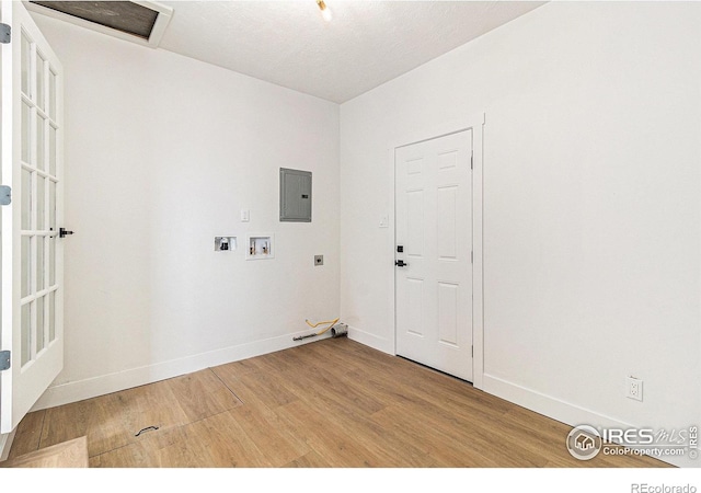 washroom featuring laundry area, baseboards, gas dryer hookup, light wood-style flooring, and hookup for a washing machine