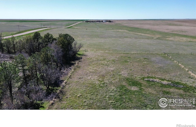 birds eye view of property featuring a rural view