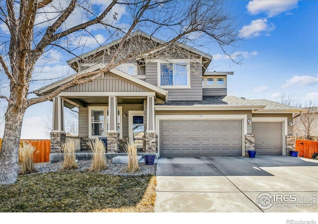 craftsman house featuring concrete driveway, a porch, roof with shingles, and fence